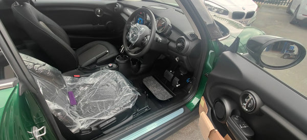 Menox-pedal-extensions-with-false-floor-fitted-in-a-mini-with-a-boot-strap Mobility Station